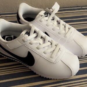 Nike Kids White Sneakers with Black Swoosh